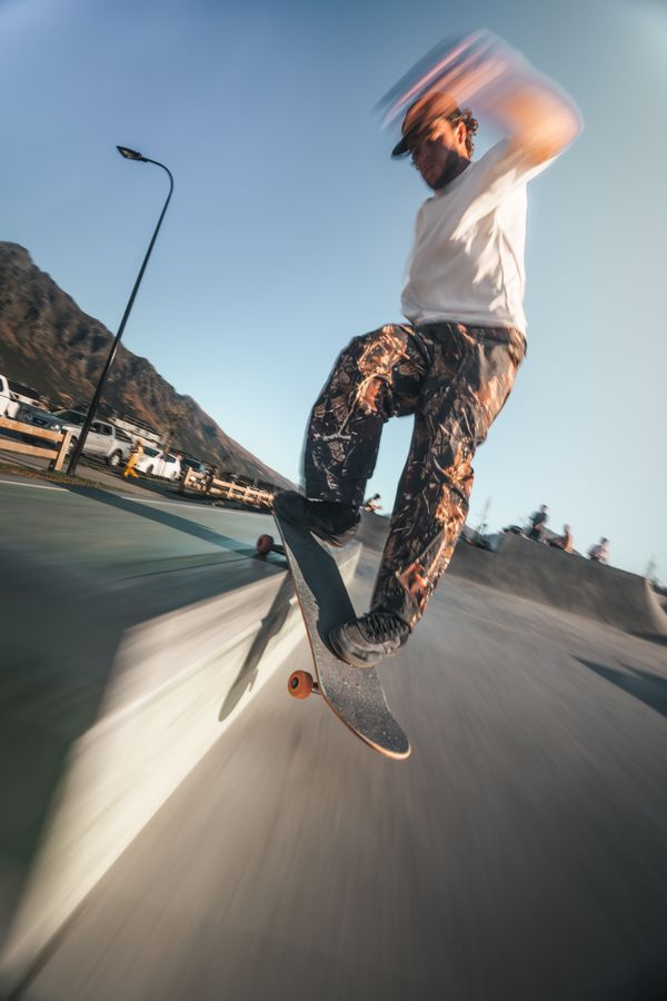 Low angle of a skater on a street bank