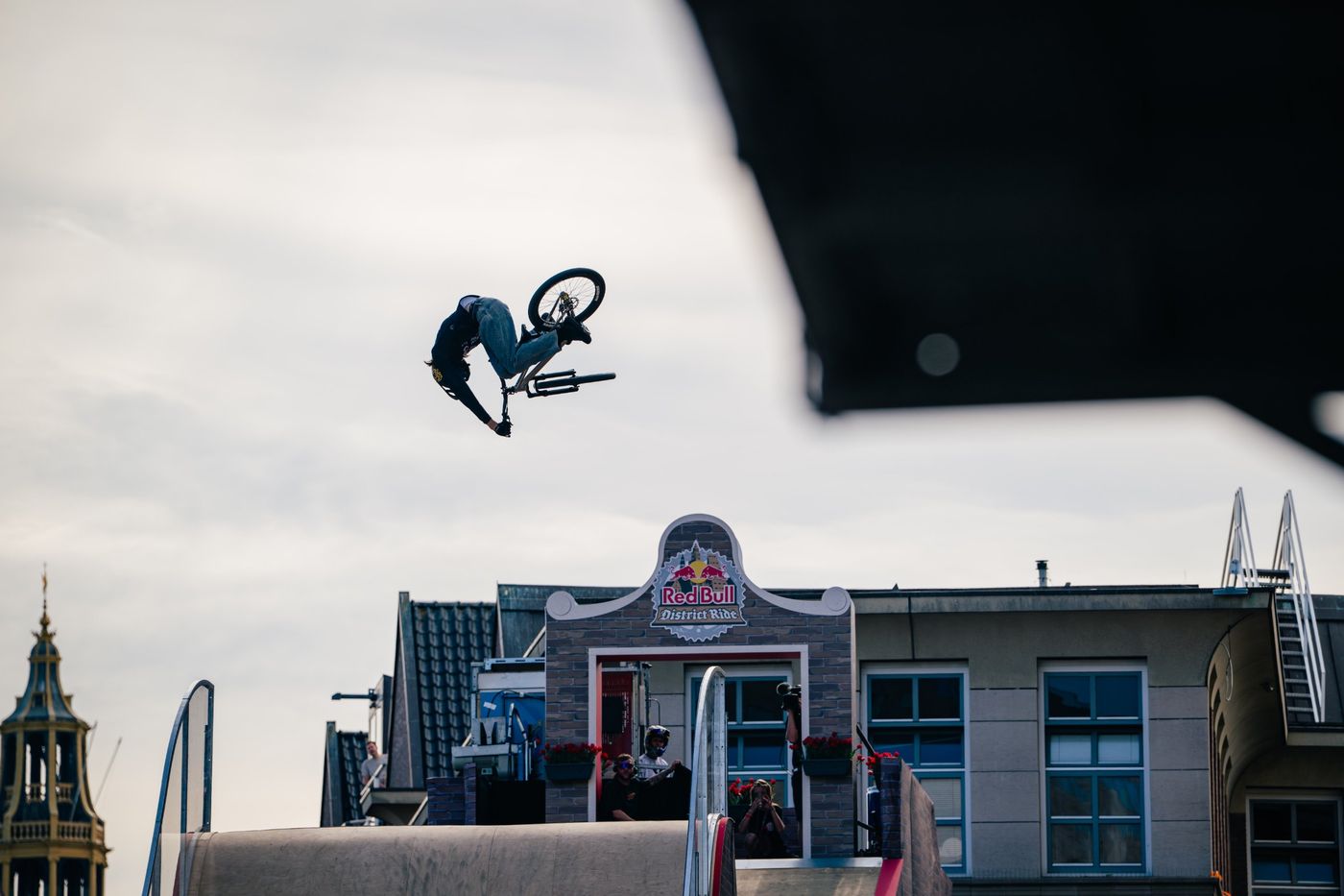 BMX rider flipping over the Red Bull District Ride course